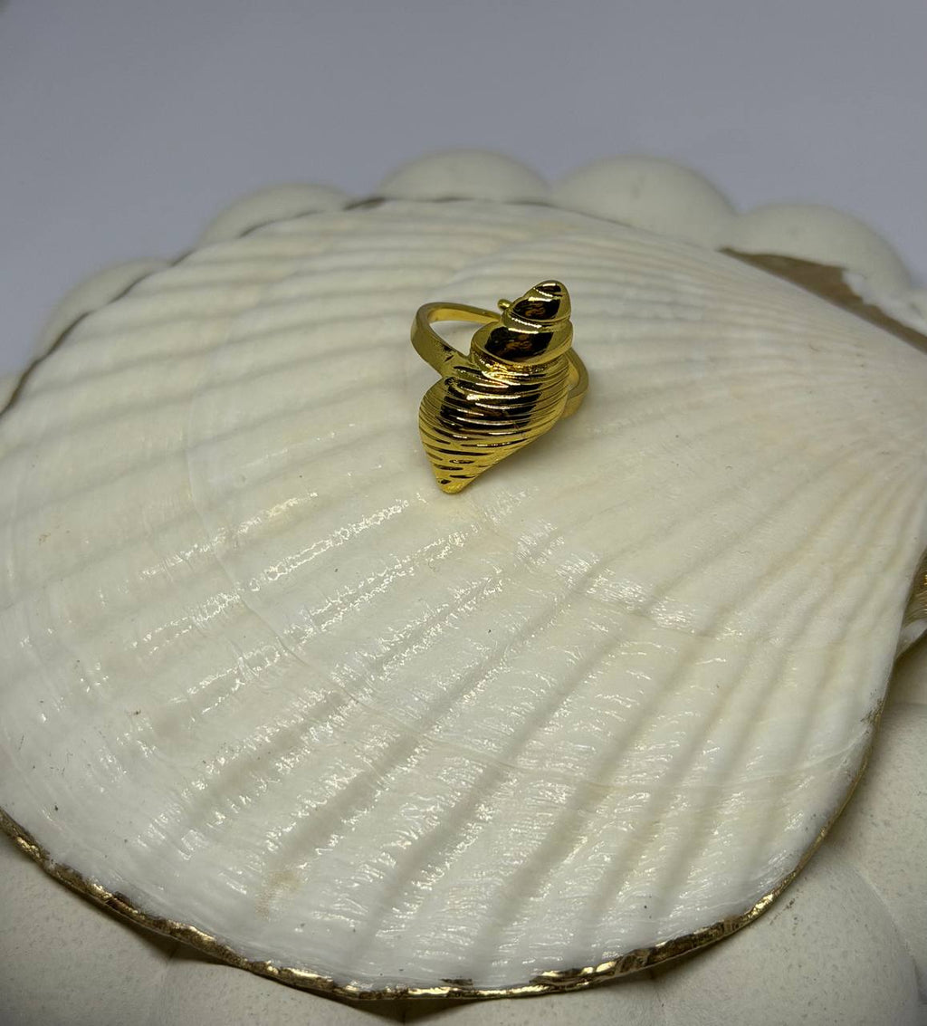Gold ring on a white shell